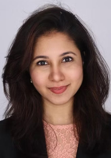 Arjumand Syed, Attorney and Head of Business Development Headshot of Arjumand Syed with long dark hair, wearing a pink top