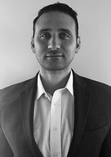 Yancy Gatus, Operations Black-and-white headshot of Sean Hanlon in a dark blazer