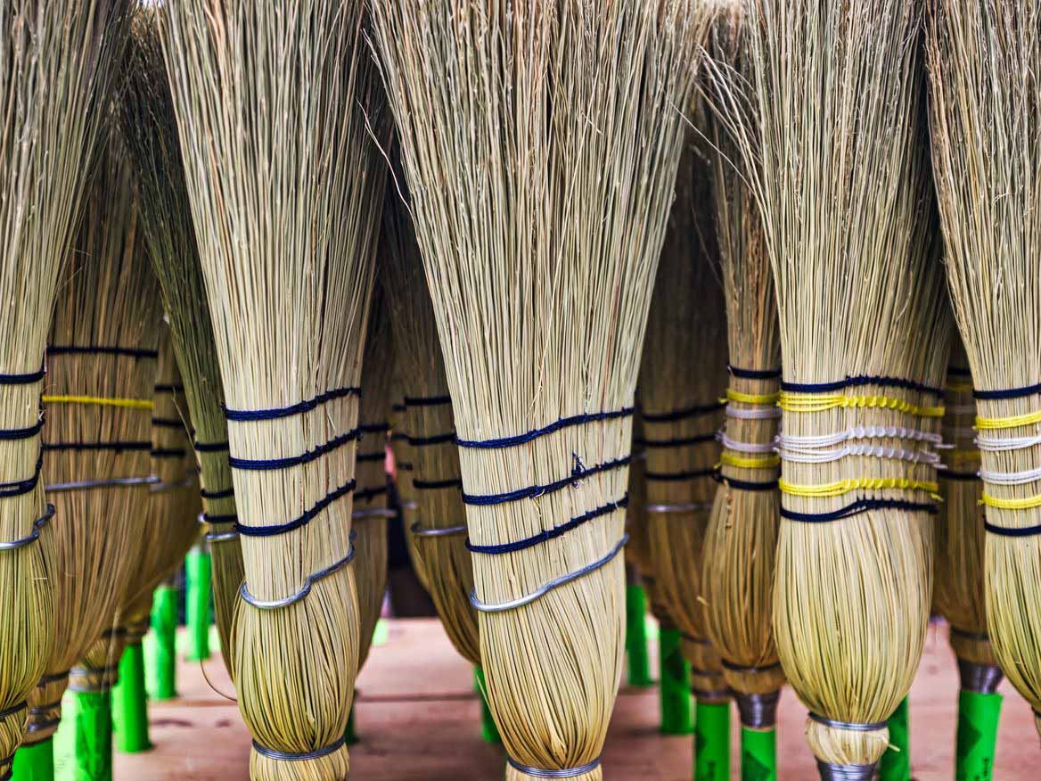 Person wiping devices clean, representing TMBTQ Law's website services and maintenance offerings.